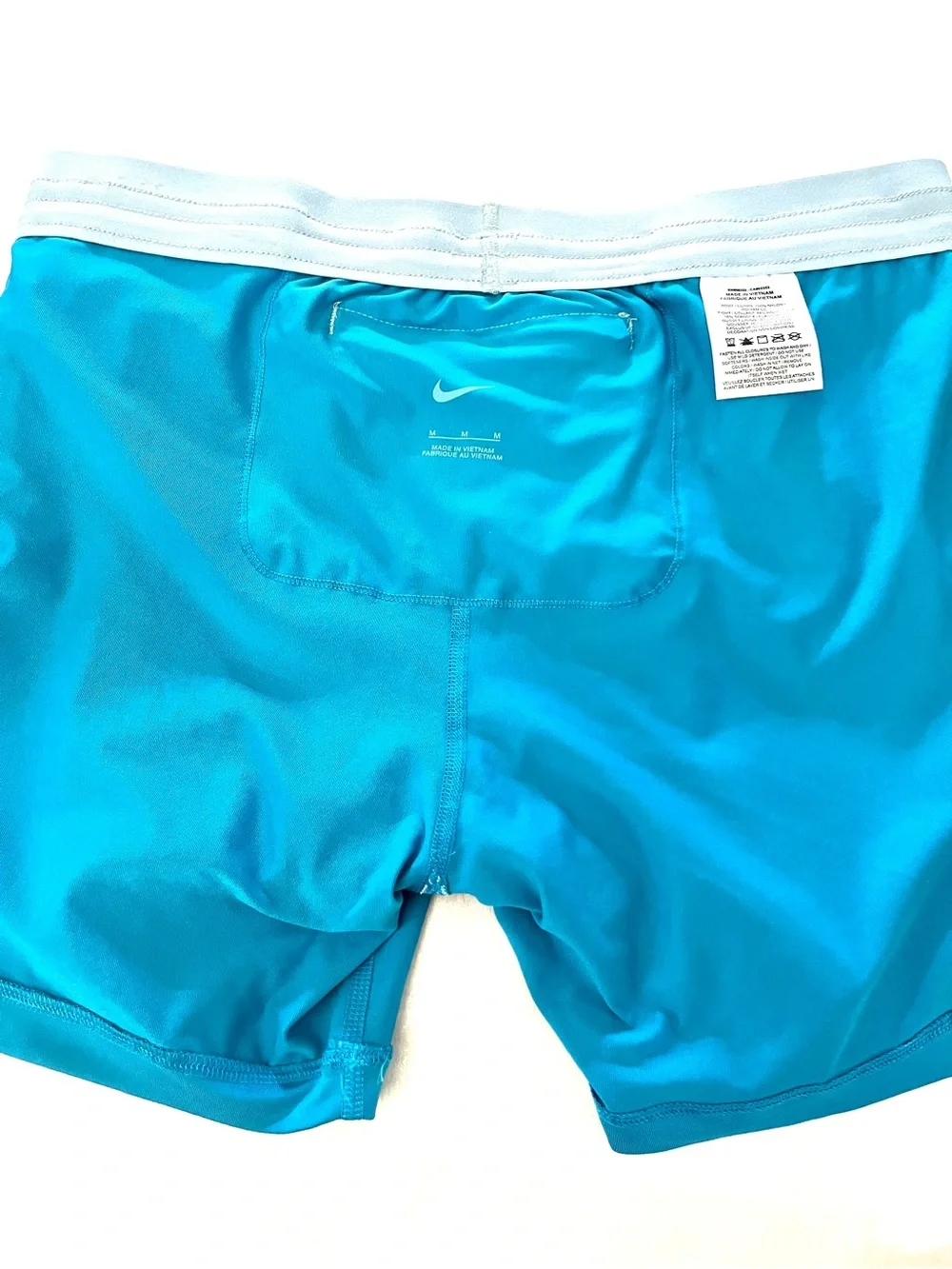 Nike Light Blue Women's Athletic Shorts with Orange Drawstring